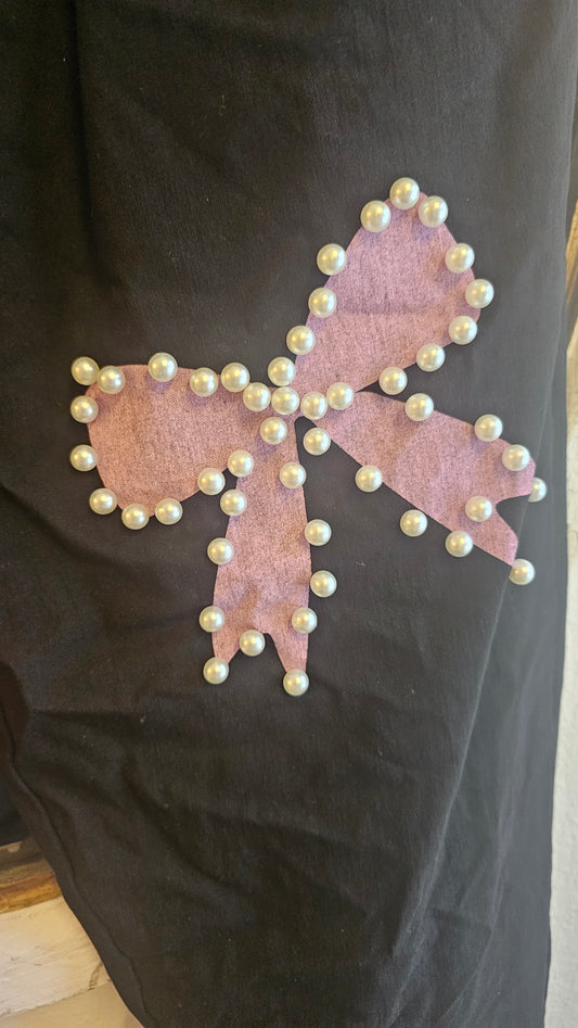 Mustat joustohousut rusetti